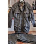 A Belstaff wax jacket, size 44, together with a pair of Trail Master trousers, size 30 and two pairs
