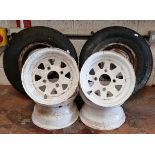 A set of four Weller white painted 6 J steel 10" wheels and a pair of Mini wheels.