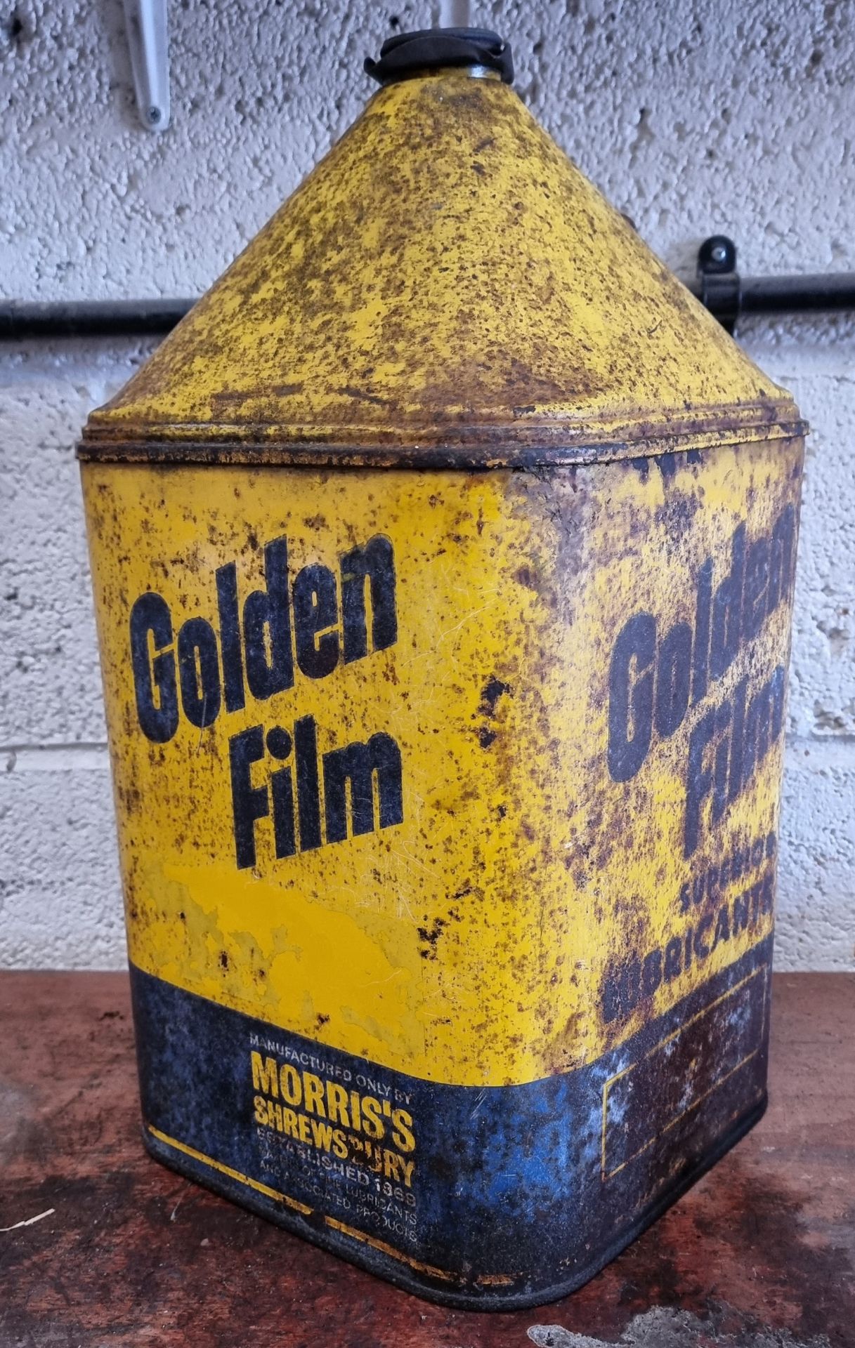 A Golden Film Superior Lubricant pyramid top can, with cap, 49cm