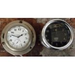 A Swiss 8 day bezel winding dash mounted clock, overall diameter 8cm, working but not guaranteed and