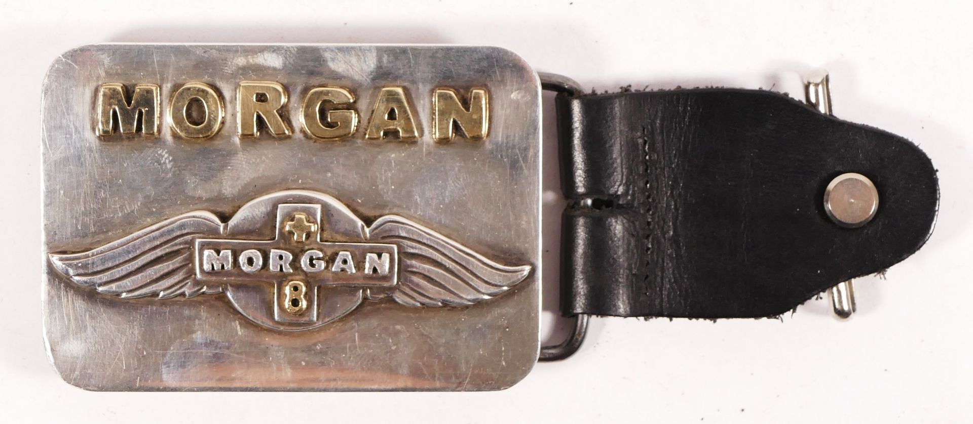 Of Morgan +8 interest; a handmade silver and unhallmarked gold belt buckle, Birmingham 2002,