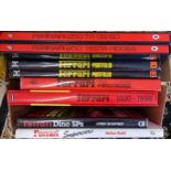A collection of 22 books related to Ferraris, including Ferrari Ecurie Garage by Nada and Ferrari