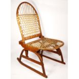 A W.F. Tubbs Co SnoShu chair, folding rocking chair, with raw hide woven seat and back rest, 81cm