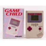 A Maxim Game Child, handheld game, in original box The Game Child was released to mimic the