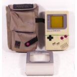 A Nintendo Game Boy, model No DMG-01 (serial No G19762931), together with a Official Game Boy