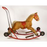 A Lines Bros Ltd child's rocking horse / push-a-long toy, steel frame with folding wheels