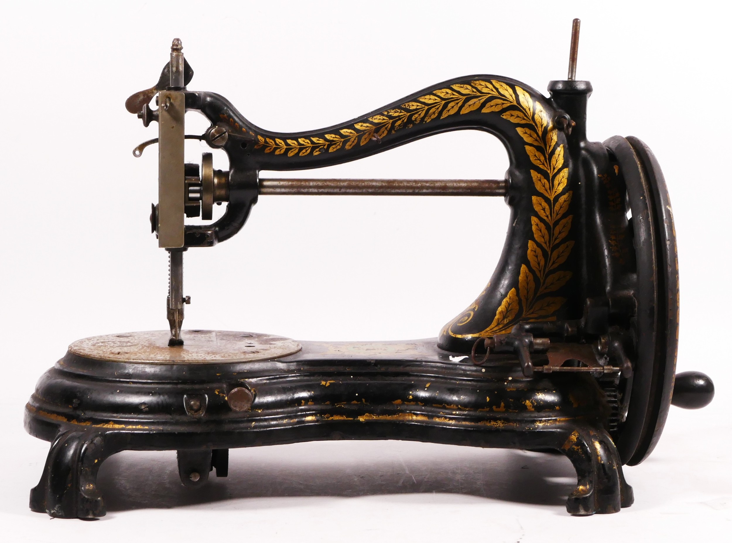 A Jones hand sewing machine, serpentine/cat back, with gilt floral decoration, 38cm long - Image 2 of 7