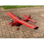 A radio controlled model plane, with a MDS 40 engine, removable wings open to reveal servos,