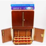 Two coin cabinets, with 14 trays, 21 x 17 x 18cm, and coin books.