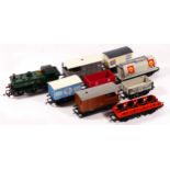 A collection of unbranded OO gauge locos and wagons, to include a G.W.R 8751 loco, in G.W.R. green