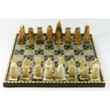 An African (possibly Egyptian) chess board with pieces, board decorated with mother of pearl and