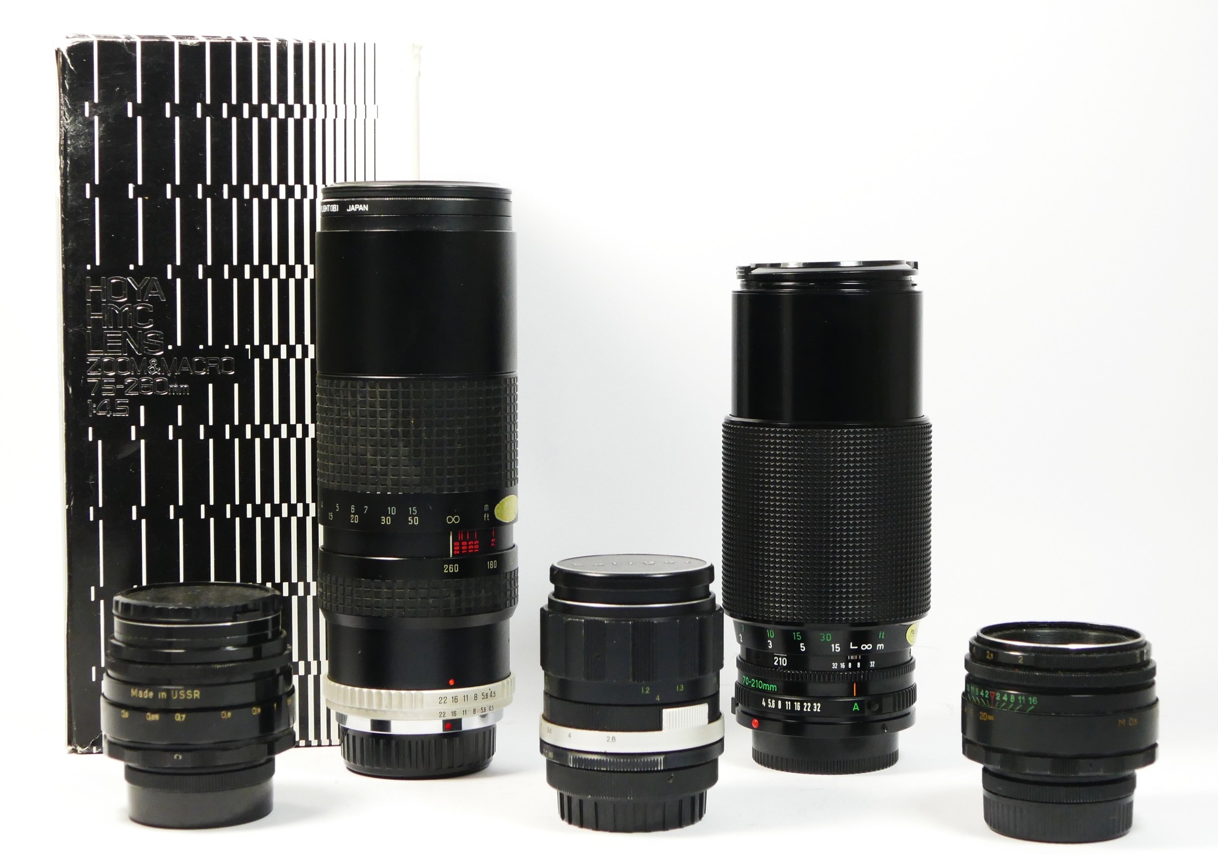 Five manual camera lens, to include a Hoya 75mm-260mm f4.5, Pentax fit, boxed, a Canon FD 70mm-210mm