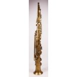 A Hawkes & Sons brass soprano saxophone, stamped with the makers mark and serial number 58665,