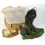 A WWII civilian gas mask stamped Poppe Lot, size medium, with carry case, together with another
