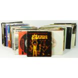 Approximately one hundred and fifteen vinyl singles mostly rock and metal, to include Thin Lizzy -