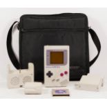 A Nintendo Game Boy, model No DMG-01 (serial No G19740910), together with a Memorex carry case, with