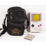 A Nintendo Game Boy, model No DMG-01 (serial No G25114611), together with a LMP Gamester carry case,