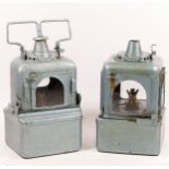 Two B.R. (M) blue/grey signal lamps, both with burners, one missing handle