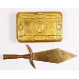 A WWI Princess Mary brass Christmas box, 1914, together with a trench art dagger, the blade etched