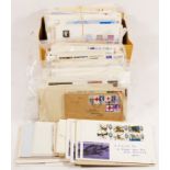 A collection of FDC (first day covers) stamps, dating through the 1960’s, both British and foreign
