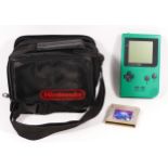 A Nintendo Game Boy Pocket, in green colourway, model No MGB-001 (serial No MH15338247), together