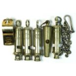 Six vintage whistles, including A.R.P. J. Hudson