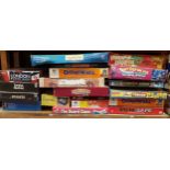 A large collection of board games and children's toys.