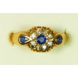 An Edwardian 18ct gold sapphire and diamond cluster ring, Chester 1905, one diamond vacant, M, 2.4gm