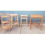 A pair of early 20th century stripped pine kitchen stools, 60cm tall, together with a pine three