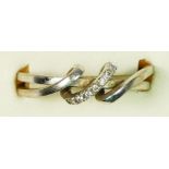 A 9ct white gold and brilliant cut diamond twist ring, N, 2.3gm