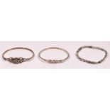 Three silver Celtic design bracelets, 32gm