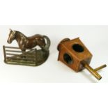 A cold cast bronze study of a horse standing in front of a fence, H22, W28cm, together with a