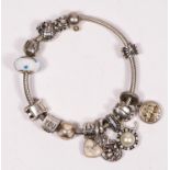 Pandora, a silver charm bracelet, 61gm.