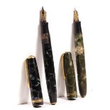 A Parker Duofold blue mottled fountain pen with 14K gold nib and a Burnam green mottled fountain pen