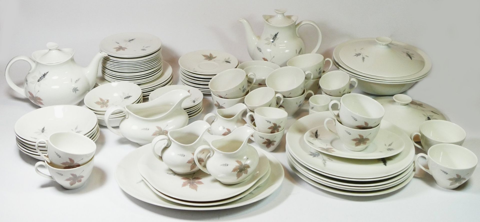 A Royal Doulton dinner service 'Tumbling Leaves' pattern TC 1004, comprising of over fifty pieces,