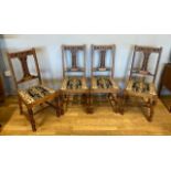 A solid oak dining suite, comprising of six carved high back chairs with upholstered seats and a