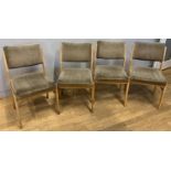 A set of four mid 20th century dining chairs, sprung seats with metal bracing, upholstered with a