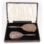 A silver hand mirror and brush set, Birmingham 1957, engine turned decoration, case.