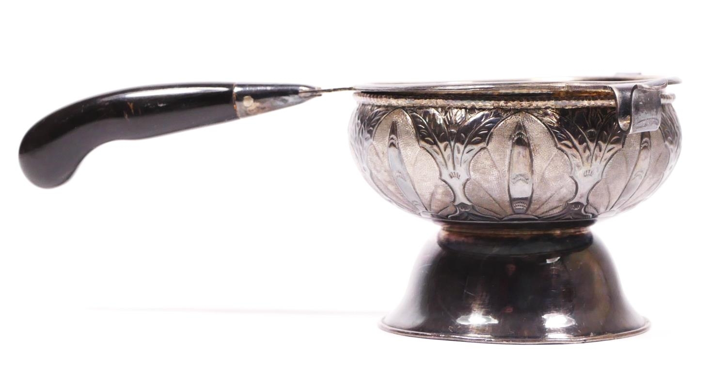 An Eastern silver tea strainer with stand, bearing marks, 49g,