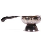 An Eastern silver tea strainer with stand, bearing marks, 49g,