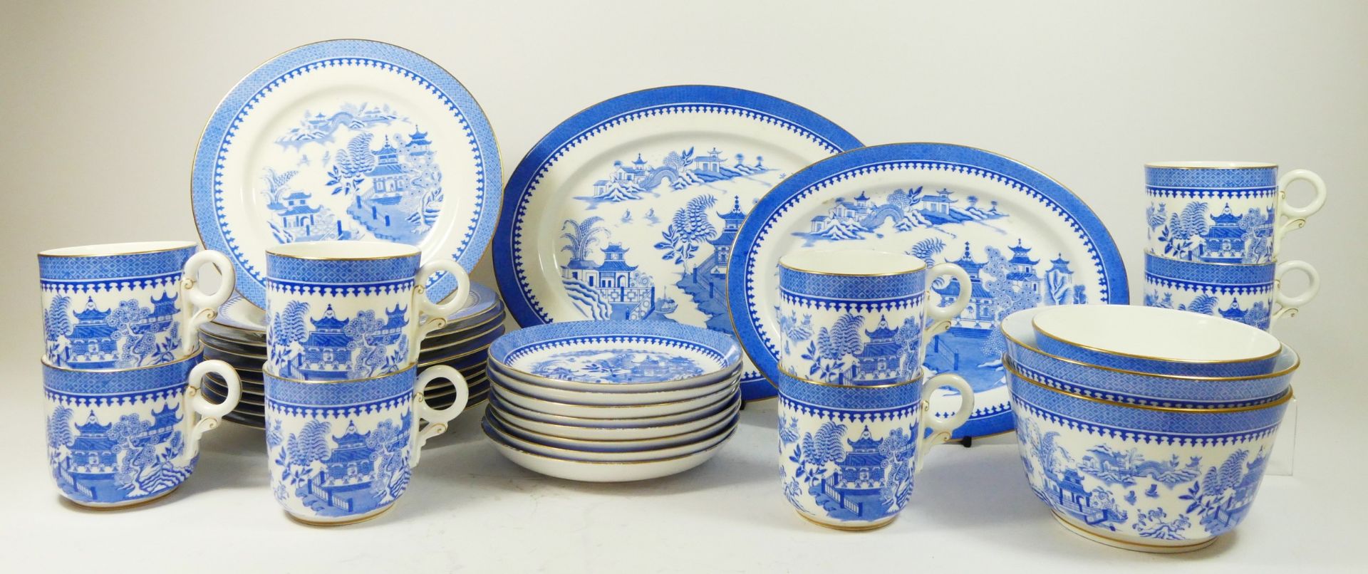 A Royal Worcester Willow pattern afternoon tea service for six place settings, green backstamp,