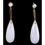 A pair of Edwardian unmarked gold and chalcedony ear pendants, pale blue stone surmounts, 50mm, case