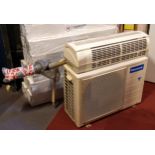 A Panasonic air conditioning unit R410A, untested, 80cm x 54cm x 30cm, together with a Panasonic Ion