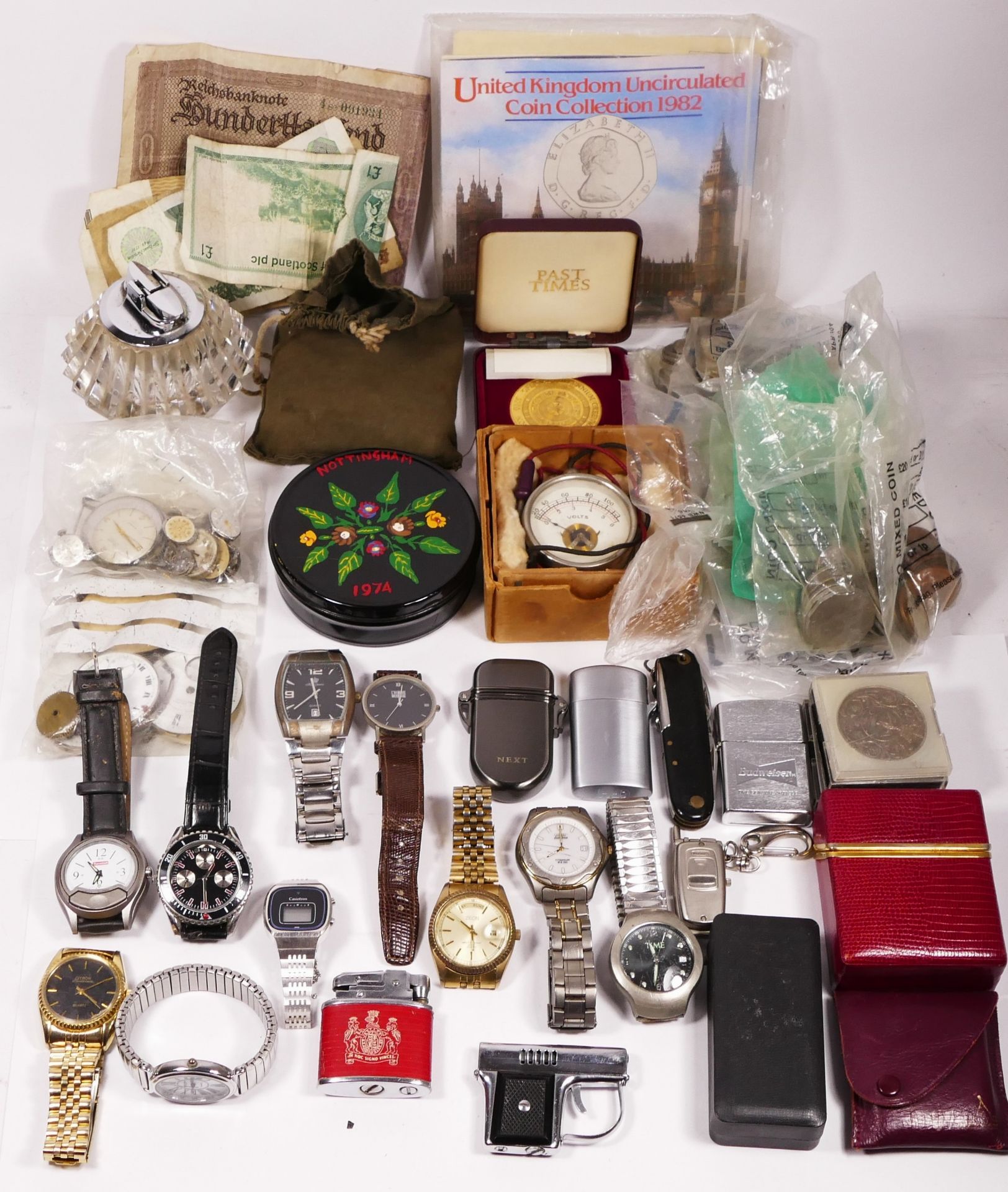 A collection of quartz fashion wristwatches, cigarette lighters and English and Overseas ex