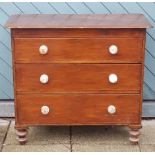 An early 20th century pine chest of drawers, graduated three height with crackle glaze finish,