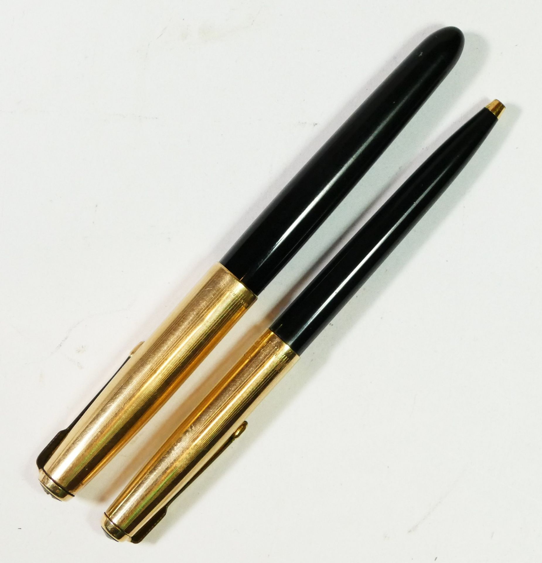 A cased Parker pen set, together with two silver dollar coins, a Silver Jubilee coin and two - Image 2 of 3