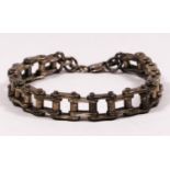 A silver bracelet in the form of bicycle or motorcycle chain, 23cm, 65gm