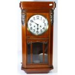 A mid 20th century Vienna style wall clock, mahogany case with 8 day movement striking on gong. 71cm