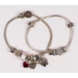 Pandora, two silver charm bracelets, 67gm