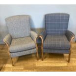 A pair of mid 20th century Parker Knoll easy chairs, having padded seats on sprung bases, shaped